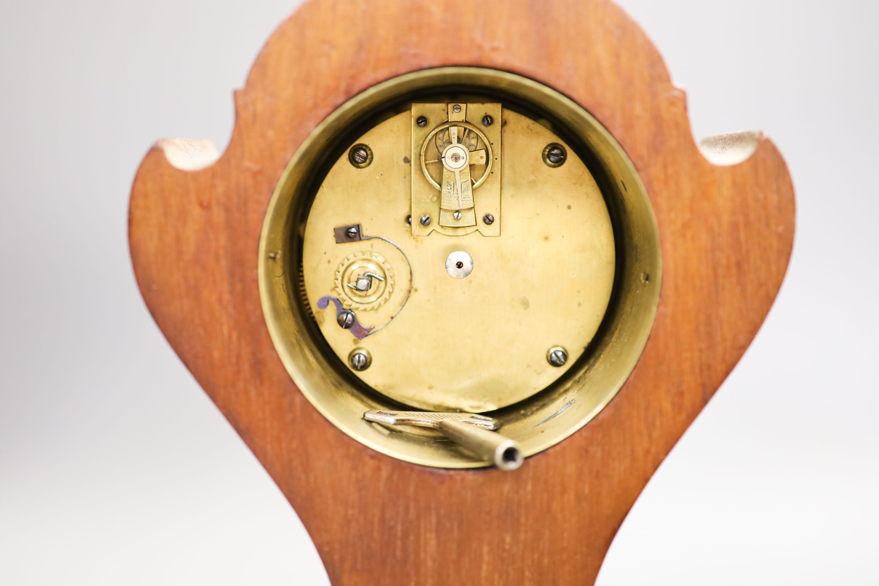 A Edwardian inlaid mahogany mantel timepiece and a brass carriage timepiece